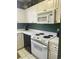 Bright kitchen featuring updated appliances, a sleek microwave, and ample cabinet space at 4639 Wild Iris Dr. # 43-204, Myrtle Beach, SC 29577