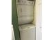 Compact laundry area with stacked washer and dryer set at 4639 Wild Iris Dr. # 43-204, Myrtle Beach, SC 29577