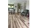 Open-concept living space showcasing the flooring and access to other areas at 4639 Wild Iris Dr. # 43-204, Myrtle Beach, SC 29577