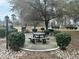 Serene park area featuring picnic tables and built-in BBQ pits for outdoor gatherings and community enjoyment at 4639 Wild Iris Dr. # 43-204, Myrtle Beach, SC 29577