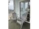 Outdoor patio has two chairs with sliding glass doors to interior at 4639 Wild Iris Dr. # 43-204, Myrtle Beach, SC 29577