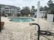 Inviting community pool with clear blue water, surrounded by brick paving and lounge chairs at 4639 Wild Iris Dr. # 43-204, Myrtle Beach, SC 29577