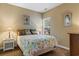 Cozy bedroom featuring a queen-sized bed, neutral walls, and a window that offers natural light at 471 Deerfield Links Dr., Surfside Beach, SC 29575