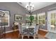 Charming dining area with hardwood floors, a chandelier, lots of natural light, and seating for six at 471 Deerfield Links Dr., Surfside Beach, SC 29575