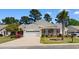 Charming single-story home with a two-car garage, brick accents, manicured lawn, and inviting curb appeal at 471 Deerfield Links Dr., Surfside Beach, SC 29575