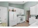 Bright kitchen with white cabinets, modern appliances, tile floors, and plenty of counter space at 471 Deerfield Links Dr., Surfside Beach, SC 29575