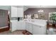 Well-lit kitchen featuring white cabinetry, tile floors, ample counter space, and modern fixtures at 471 Deerfield Links Dr., Surfside Beach, SC 29575