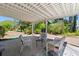 Charming outdoor patio featuring comfortable seating and a serene backyard view, perfect for relaxation and entertaining at 471 Deerfield Links Dr., Surfside Beach, SC 29575