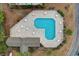 Aerial view of a pool surrounded by a deck with seating for socializing at 471 Deerfield Links Dr., Surfside Beach, SC 29575