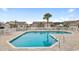 Community pool area featuring a well-maintained pool, brick deck, and nearby buildings at 471 Deerfield Links Dr., Surfside Beach, SC 29575