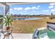 Picturesque backyard features a hot tub, outdoor seating, and a lake view at 5606 Whitebark Dr., Myrtle Beach, SC 29577