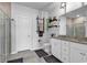 Bathroom featuring a granite countertop, tiled shower, and decorative shelf at 5606 Whitebark Dr., Myrtle Beach, SC 29577