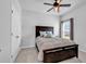 This bedroom offers a dark wood bed frame, a ceiling fan, and a double door closet at 5606 Whitebark Dr., Myrtle Beach, SC 29577