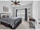 Bedroom with metal bed frame and decorative elements is illuminated by natural light through a window at 5606 Whitebark Dr., Myrtle Beach, SC 29577