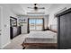 This bedroom features recessed lighting, a ceiling fan, a TV and two large windows at 5606 Whitebark Dr., Myrtle Beach, SC 29577