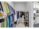 Walk-in closet features organized hanging clothes and a shelf and drawer unit at 5606 Whitebark Dr., Myrtle Beach, SC 29577