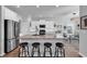 Bright kitchen featuring a large island with seating, stainless appliances, and an adjacent dining area at 5606 Whitebark Dr., Myrtle Beach, SC 29577