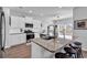 Modern kitchen island with granite countertops, seating, stainless steel appliances, and ample cabinet space at 5606 Whitebark Dr., Myrtle Beach, SC 29577