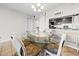 Cozy dining area with seating for six and pass-through view to the kitchen at 601 Mitchell Dr. # 801, Myrtle Beach, SC 29577