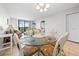 Open concept dining area with a glass top table and comfortable seating at 601 Mitchell Dr. # 801, Myrtle Beach, SC 29577