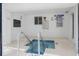 The indoor hot tub area has tile flooring and necessary safety guidelines posted for a safe and enjoyable experience at 601 Mitchell Dr. # 801, Myrtle Beach, SC 29577