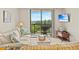 Inviting living room with a balcony, comfortable seating, and natural light at 601 Mitchell Dr. # 801, Myrtle Beach, SC 29577