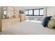 Comfortable bedroom with city views, ample natural light, and furniture at 601 Mitchell Dr. # 801, Myrtle Beach, SC 29577