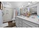 Bright bathroom boasts double vanity, a walk-in shower, and tiled accents at 100 Marblehead Dr., Little River, SC 29566