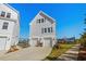 Charming home exterior featuring a two-car garage, well-maintained landscaping, and inviting curb appeal at 100 Marblehead Dr., Little River, SC 29566