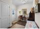 Inviting foyer with hardwood floors, bright natural light, and views to the water at 100 Marblehead Dr., Little River, SC 29566