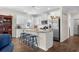 Bright kitchen with granite countertops, stainless steel appliances, and eat-in breakfast bar at 100 Marblehead Dr., Little River, SC 29566