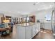 Open kitchen design featuring white cabinets, granite counters, breakfast bar and seamless access to other living areas at 100 Marblehead Dr., Little River, SC 29566