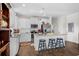Bright kitchen with white cabinets, stainless appliances, granite countertops, and a breakfast bar with seating at 100 Marblehead Dr., Little River, SC 29566
