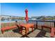 Outdoor dining area on a deck overlooking the water, ideal for enjoying meals with a view at 100 Marblehead Dr., Little River, SC 29566