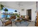 Inviting covered patio with comfortable seating and serene waterfront views, perfect for outdoor relaxation at 100 Marblehead Dr., Little River, SC 29566