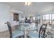Dining area with seating for four, leading to the living room and balcony at 108 Ocean Blvd. N # 101, North Myrtle Beach, SC 29582