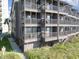 Condo exterior features multiple balconies on each floor for enjoying the coastal views at 108 Ocean Blvd. N # 101, North Myrtle Beach, SC 29582