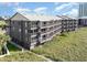 Exterior angle view of condo, highlighting the construction and multiple screened in balconies at 108 Ocean Blvd. N # 101, North Myrtle Beach, SC 29582