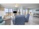 Bright living room featuring comfortable seating and balcony with ocean views at 108 Ocean Blvd. N # 101, North Myrtle Beach, SC 29582