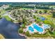 Aerial view of community amenities featuring pool, clubhouse, tennis courts, and parking at 1121 Glossy Ibis Dr., Conway, SC 29526