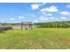 Beautiful backyard with a firepit and seating area overlooking the lake at 1121 Glossy Ibis Dr., Conway, SC 29526