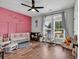 Cozy bedroom with wood floors, soft rug, charming decor and plenty of natural light at 1121 Glossy Ibis Dr., Conway, SC 29526