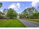 Community entrance showcases lush green landscaping, fountains and brick pillars with signage at 1121 Glossy Ibis Dr., Conway, SC 29526