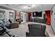 Spacious theater room featuring tiered seating, projector screen, and a cozy atmosphere at 1121 Glossy Ibis Dr., Conway, SC 29526