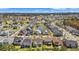 Aerial view of a residential neighborhood with well-maintained homes, a pond, and lush green landscaping at 1127 East Isle Of Palms Ave., Myrtle Beach, SC 29579