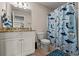 Bathroom featuring a single vanity with granite counter, a shower/tub combo, and neutral-colored walls at 1127 East Isle Of Palms Ave., Myrtle Beach, SC 29579