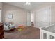 Cozy Bedroom features ample natural light, a white crib, and comfortable rocking chair at 1127 East Isle Of Palms Ave., Myrtle Beach, SC 29579