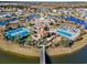 Aerial view of community center featuring pools, tennis courts, clubhouse, and beautiful landscaping at 1127 East Isle Of Palms Ave., Myrtle Beach, SC 29579