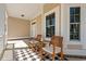 Relaxing front porch featuring rocking chairs, creating a welcoming outdoor space at 1127 East Isle Of Palms Ave., Myrtle Beach, SC 29579