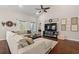 Comfortable living room with a large sectional sofa, and a view of the backyard at 1127 East Isle Of Palms Ave., Myrtle Beach, SC 29579